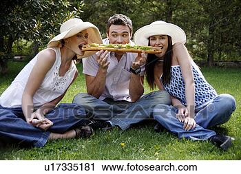 Stock Photography - three friends 
sharing a big 
sandwich. fotosearch 
- search stock 
photos, pictures, 
images, and photo 
clipart