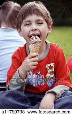 Stock Photo - young boy eating 
ice cream. fotosearch 
- search stock 
photos, pictures, 
images, and photo 
clipart