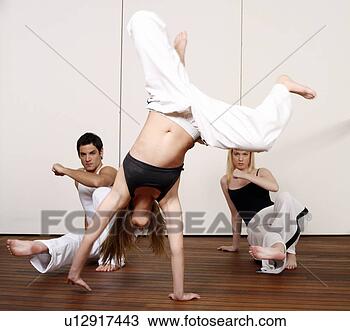 Stock Photo - students practicing 
capoeira. fotosearch 
- search stock 
photos, pictures, 
images, and photo 
clipart