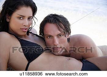 Stock Photo - young couple on 
beach together. 
fotosearch - search 
stock photos, 
pictures, images, 
and photo clipart