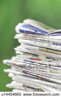 Stock Photo - newspapers tied 
into a pile for 
the recycle bin. 
fotosearch - search 
stock photos, 
pictures, images, 
and photo clipart
