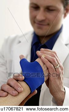 Stock Photography - woman having physical 
therapy. fotosearch 
- search stock 
photos, pictures, 
images, and photo 
clipart