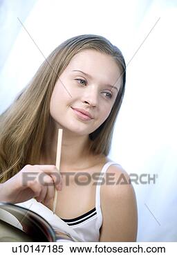 Stock Image - daily life, one 
person, one young 
woman only. fotosearch 
- search stock 
photos, pictures, 
images, and photo 
clipart