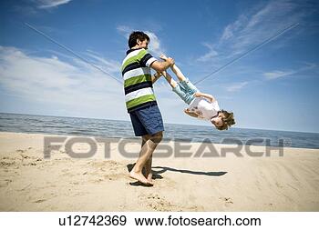 http://comps.fotosearch.com/comp/UNQ/UNQ345/man-swings-girl_~u12742369.jpg