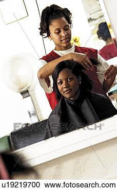 Stock Photography - african american 
woman getting 
a haircut. fotosearch 
- search stock 
photos, pictures, 
images, and photo 
clipart