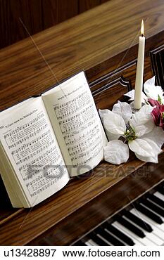 Foto - hymnal,  piano. 
fotosearch - busca 
de fotos, imagens 
e clipart