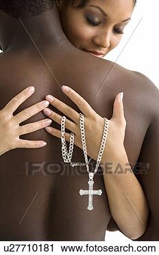Stock Photography - african american 
couple holding 
each other. fotosearch 
- search stock 
photos, pictures, 
images, and photo 
clipart