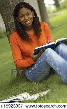 Picture - girl studying 
under tree. fotosearch 
- search stock 
photos, pictures, 
images, and photo 
clipart