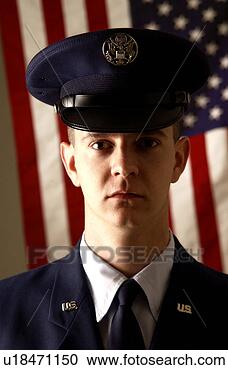 Stock Photography - soldier standing 
in front of american 
flag. fotosearch 
- search stock 
photos, pictures, 
images, and photo 
clipart