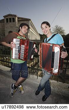 Stock Photo - couple at archaeological 
site playing accordion. 
fotosearch - search 
stock photos, 
pictures, images, 
and photo clipart