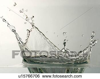 Stock Photo - splash in water 
creating crown 
of water droplets, 
close-up. fotosearch 
- search stock 
photos, pictures, 
images, and photo 
clipart