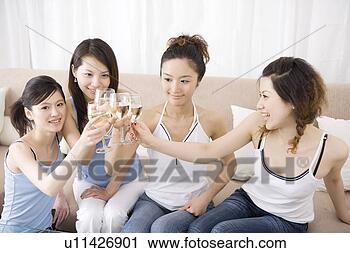 Stock Photography - four young women 
toasting with 
wineglasses. fotosearch 
- search stock 
photos, pictures, 
images, and photo 
clipart