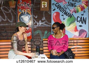 Picture - women at coffe 
shop, kensington 
market area, toronto, 
ontario, canada. 
fotosearch - search 
stock photos, 
pictures, images, 
and photo clipart