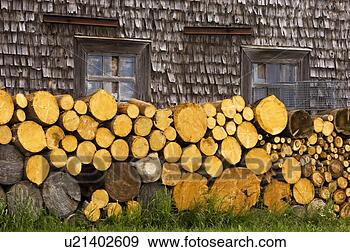Stock Photograph - woodpile stacked 
along weathered 
wall of house, 
 gaspe peninsula. 
fotosearch - search 
stock photos, 
pictures, images, 
and photo clipart