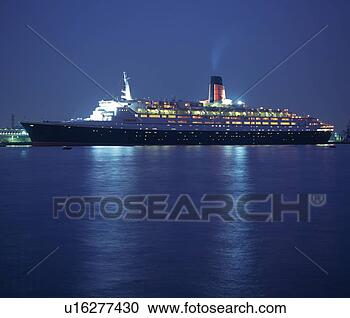 Stock Photography - a huge illuminated 
passenger boat 
floating on the 
ocean,  side view. 
fotosearch - search 
stock photos, 
pictures, images, 
and photo clipart