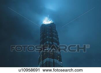 Stock Photography - the jin mao tower 
under a cloudy 
sky,  the top 
shining in a blue. 
fotosearch - search 
stock photos, 
pictures, images, 
and photo clipart