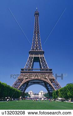 Stock Photo - image of the eiffel 
tower under a 
blue sky,  with 
several trees 
on. fotosearch 
- search stock 
photos, pictures, 
images, and photo 
clipart