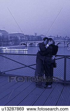 Stock Photograph - image of a couple 
hugging each other 
on a bridge at 
the seine,  side. 
fotosearch - search 
stock photos, 
pictures, images, 
and photo clipart
