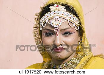 Stock Photography - portrait of a 
female performer 
smiling, jaipur, 
rajasthan, india. 
fotosearch - search 
stock photos, 
pictures, images, 
and photo clipart