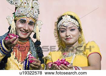 Stock Photo - portrait of two 
performers holding 
rose petals,  
elephant festival. 
fotosearch - search 
stock photos, 
pictures, images, 
and photo clipart