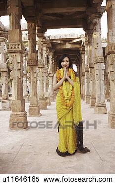 Stock Image - portrait of a 
young woman standing 
in a prayer position 
wearing. fotosearch 
- search stock 
photos, pictures, 
images, and photo 
clipart