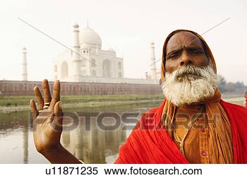 Stock Image - portrait of a 
priest standing 
on the riverbank, 
 taj mahal,  agra. 
fotosearch - search 
stock photos, 
pictures, images, 
and photo clipart