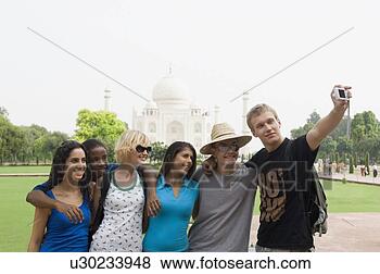 Stock Photo - three young couples 
taking a picture 
of themselves 
in front of a. 
fotosearch - search 
stock photos, 
pictures, images, 
and photo clipart