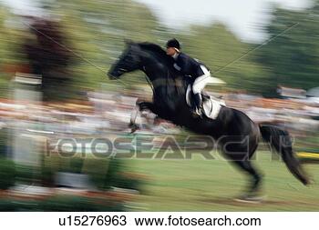 Stock Photo - horse jumping 
at an equestrian 
competition. fotosearch 
- search stock 
photos, pictures, 
images, and photo 
clipart