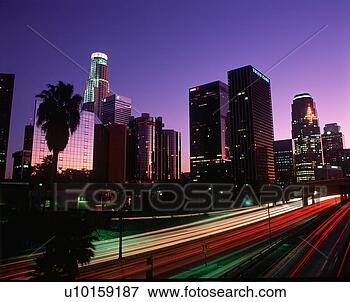 Picture - abstract of the 
harbor freeway 
with los angeles 
skyline at night. 
fotosearch - search 
stock photos, 
pictures, images, 
and photo clipart