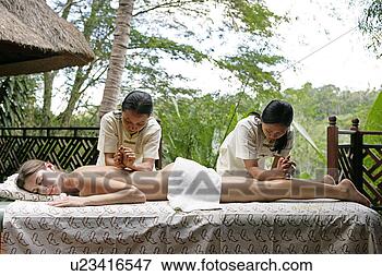 Picture - view of a young 
woman taking massage 
in a health spa. 
fotosearch - search 
stock photos, 
pictures, images, 
and photo clipart