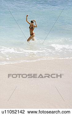 Stock Photo - view of a woman 
bathing. fotosearch 
- search stock 
photos, pictures, 
images, and photo 
clipart