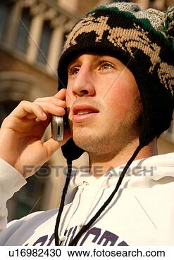 Stock Photography - portrait of a 
young man conversing 
on his cell phone. 
fotosearch - search 
stock photos, 
pictures, images, 
and photo clipart