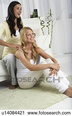 Stock Photography - a woman massaging 
another. fotosearch 
- search stock 
photos, pictures, 
images, and photo 
clipart
