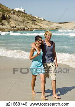 Stock Photo - a couple on the 
beach. fotosearch 
- search stock 
photos, pictures, 
images, and photo 
clipart