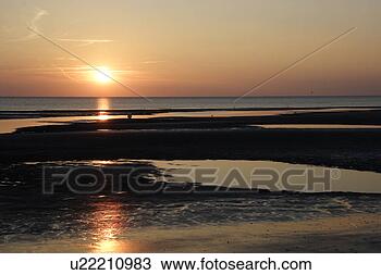 Stock Photo - beach, coast, 
ebb, evening, 
evening atmosphere, 
germany, gluupoog. 
fotosearch - search 
stock photos, 
pictures, images, 
and photo clipart