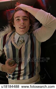 Stock Photo - view of a young 
man lying down 
with wineglass. 
fotosearch - search 
stock photos, 
pictures, images, 
and photo clipart