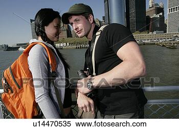 Banco de Imagem - interracial,  
par,  ficar,  
bote. fotosearch 
- busca de fotos, 
imagens e clipart