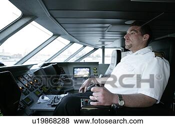 Stock Photo - person driving 
a boat. fotosearch 
- search stock 
photos, pictures, 
images, and photo 
clipart