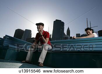 Stock Photo - two people sitting 
on benches smiling. 
fotosearch - search 
stock photos, 
pictures, images, 
and photo clipart