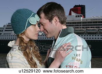 Stock Photography - young couple looking 
into each others 
eyes. fotosearch 
- search stock 
photos, pictures, 
images, and photo 
clipart