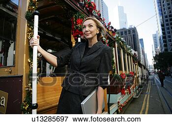 Picture - mature business 
womanon a trolley. 
fotosearch - search 
stock photos, 
pictures, images, 
and photo clipart