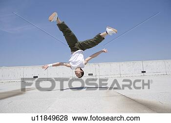 Stock Photo - young man dancing. 
fotosearch - search 
stock photos, 
pictures, images, 
and photo clipart