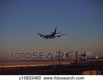 Stock Photography - airplane landing. 
fotosearch - search 
stock photos, 
pictures, images, 
and photo clipart