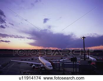 Stock Photo - airplane parked 
at airport gate. 
fotosearch - search 
stock photos, 
pictures, images, 
and photo clipart