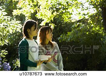 Stock Photo - two young women 
looking ahead. 
fotosearch - search 
stock photos, 
pictures, images, 
and photo clipart