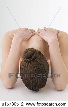 Stock Photo - young woman touching 
her shoulders. 
fotosearch - search 
stock photos, 
pictures, images, 
and photo clipart