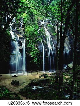 Stock Photo - scenic view of 
waterfall and 
trees. fotosearch 
- search stock 
photos, pictures, 
images, and photo 
clipart