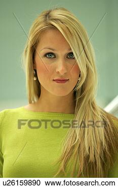 Stock Photography - portrait of young 
business woman 
with long blond 
hair wearing green. 
fotosearch - search 
stock photos, 
pictures, images, 
and photo clipart