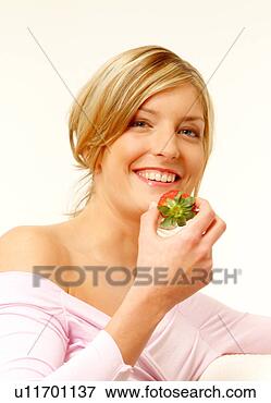 Picture - woman eating strawberry. 
fotosearch - search 
stock photos, 
pictures, images, 
and photo clipart