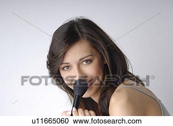 Stock Photography - young woman applying 
make-up. fotosearch 
- search stock 
photos, pictures, 
images, and photo 
clipart